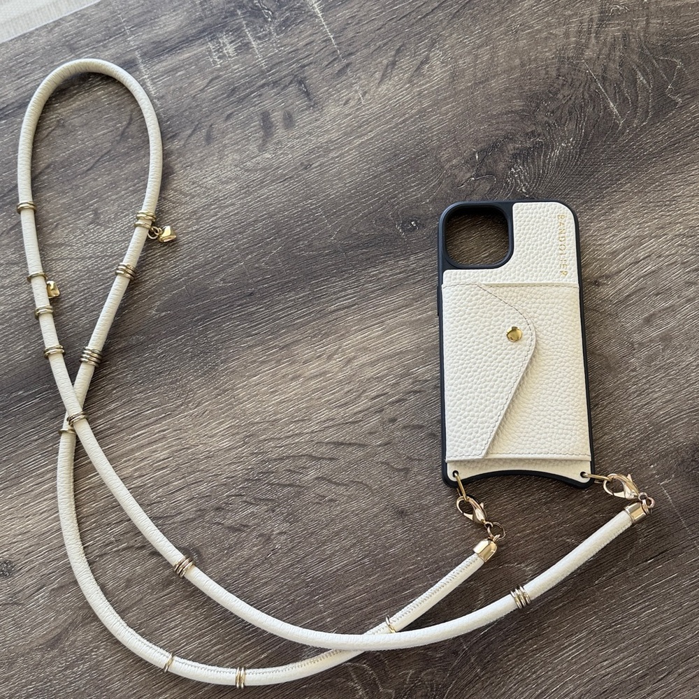 Bandolier Cream Leather IPhone 15 Case with Cream Strap and Gold Accents